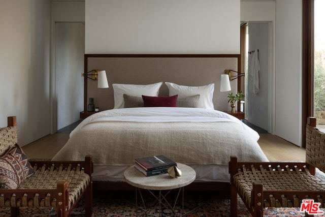 bedroom with hardwood / wood-style flooring