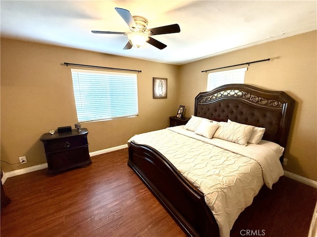 bedroom featuring ceiling fan and dark hardwood / wood-style floors