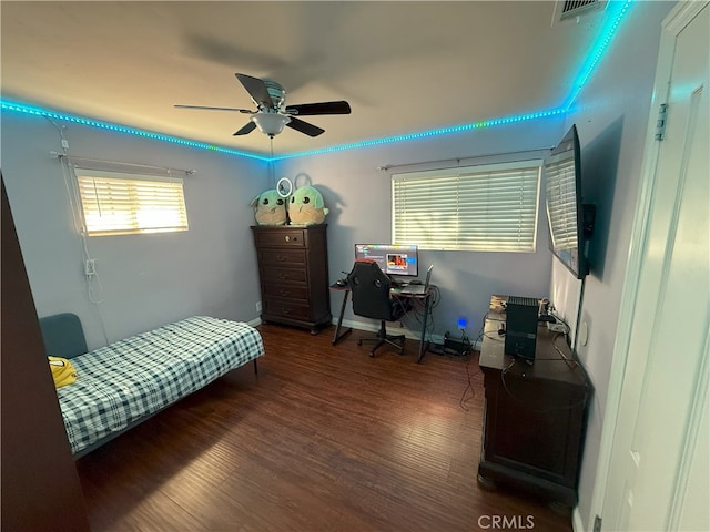 bedroom with dark wood-type flooring and ceiling fan