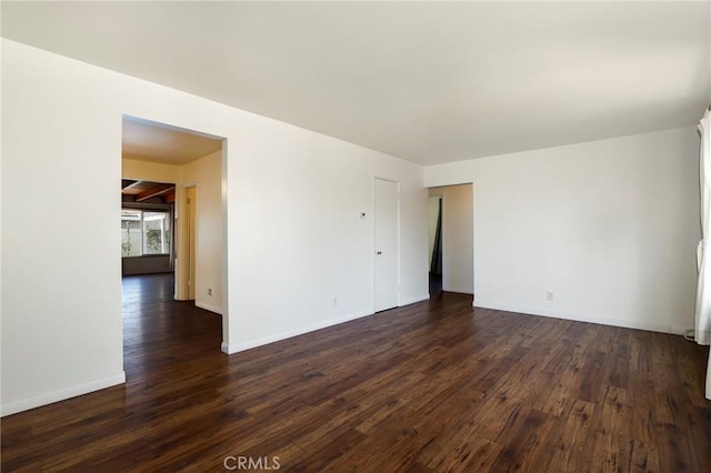 empty room featuring dark hardwood / wood-style floors