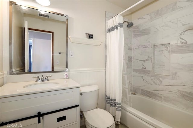 full bathroom with vanity, toilet, and shower / tub combo