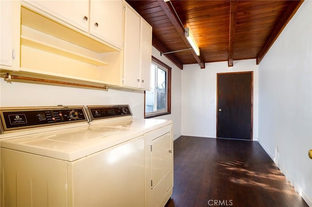 laundry area featuring wooden ceiling, cabinets, dark hardwood / wood-style floors, and washer and clothes dryer