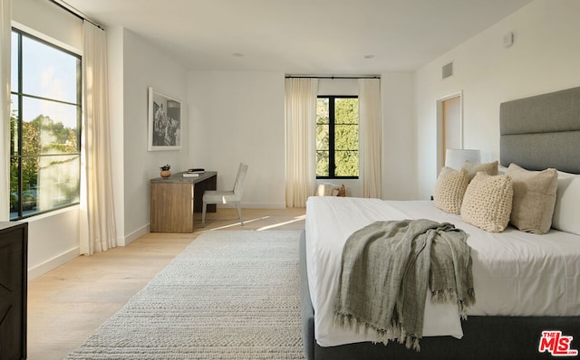 bedroom with light wood-type flooring