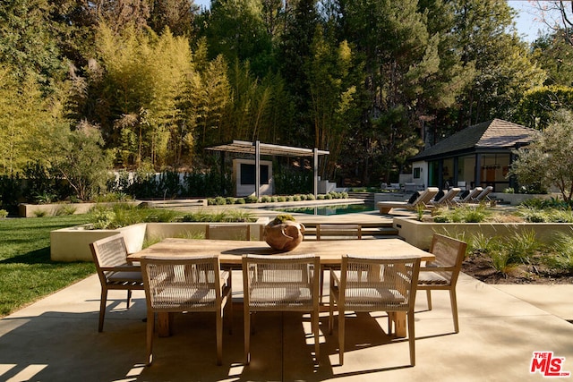 view of patio / terrace featuring an outbuilding