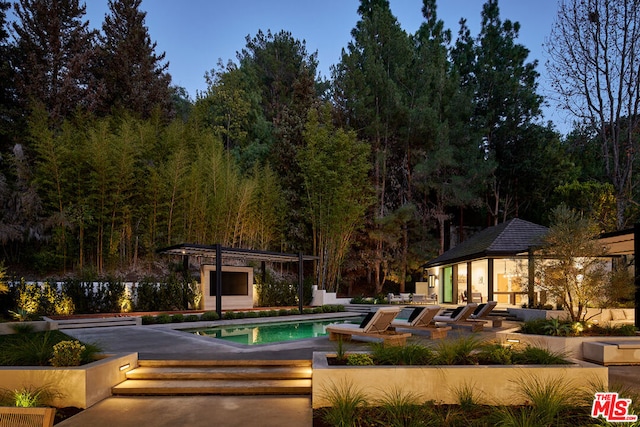 view of swimming pool featuring a patio