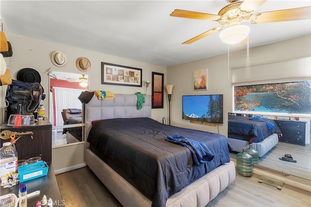 bedroom featuring ceiling fan and hardwood / wood-style floors