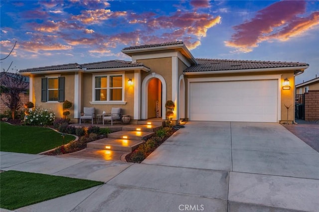 mediterranean / spanish-style house featuring a garage