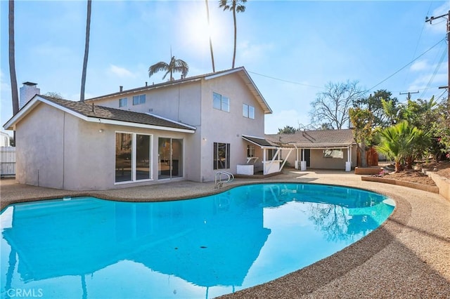 rear view of house featuring a patio