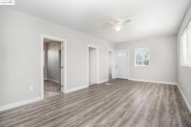 interior space featuring ceiling fan and wood-type flooring