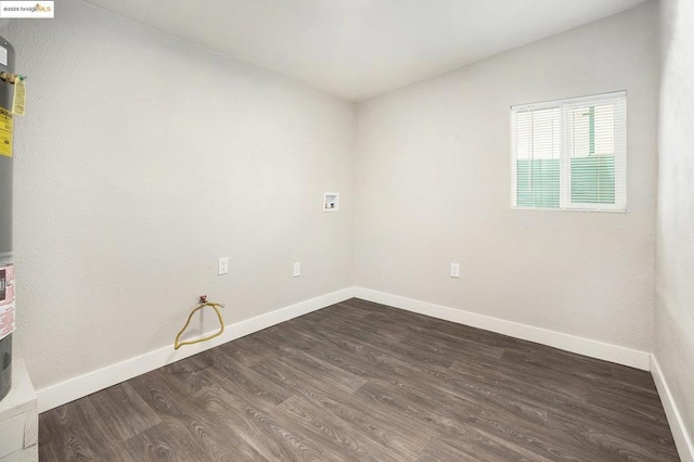 laundry area with hookup for a washing machine and dark hardwood / wood-style flooring