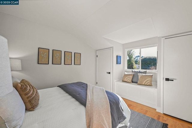 bedroom with vaulted ceiling