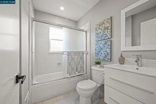 full bathroom with vanity, tile patterned floors, shower / bath combination with glass door, and toilet