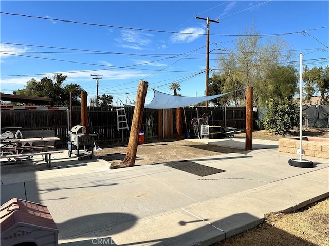 view of playground featuring a patio