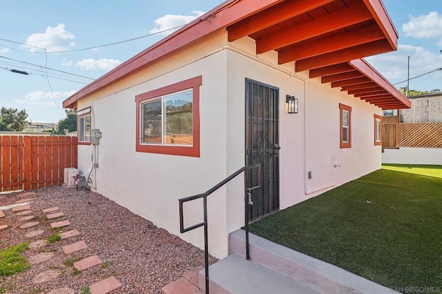 view of side of property featuring a yard