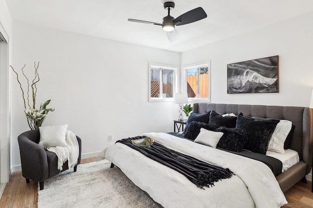 bedroom featuring ceiling fan and hardwood / wood-style floors