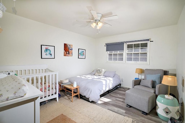 bedroom featuring ceiling fan and light hardwood / wood-style floors