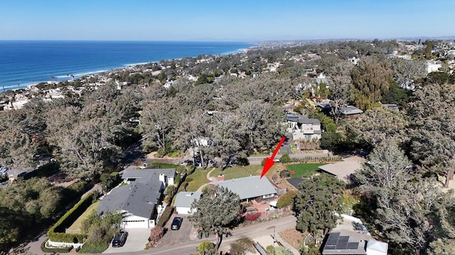 drone / aerial view with a water view and a beach view