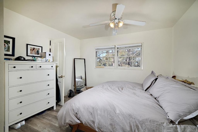 bedroom with ceiling fan and hardwood / wood-style flooring