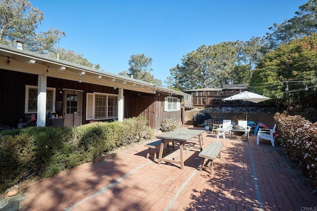 view of patio with a fire pit