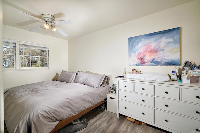 bedroom featuring ceiling fan and wood-type flooring