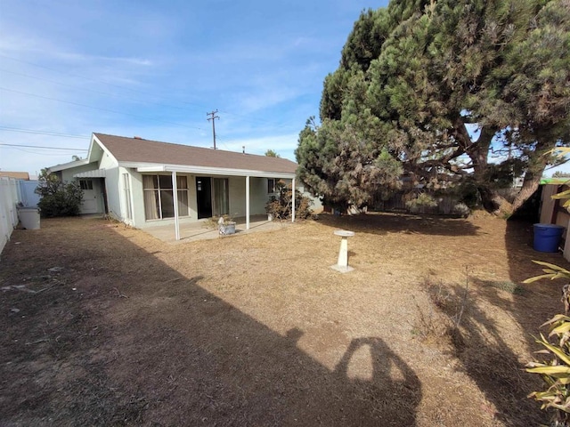 back of house featuring a patio