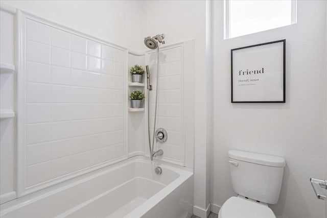 bathroom with toilet and shower / bath combination