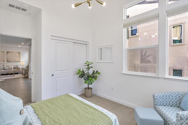 carpeted bedroom with a closet