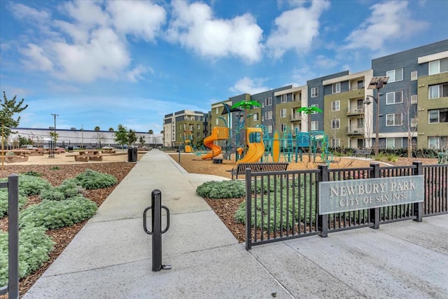 view of home's community featuring a playground