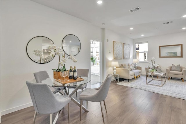 dining space featuring hardwood / wood-style flooring