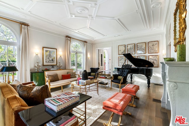 interior space featuring coffered ceiling, a wealth of natural light, hardwood / wood-style floors, and crown molding