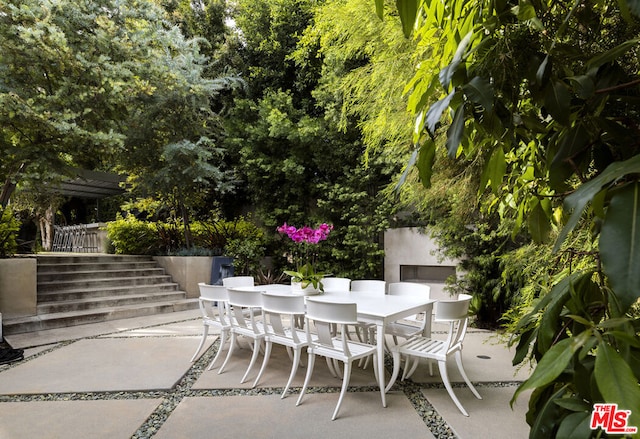 view of patio featuring exterior fireplace