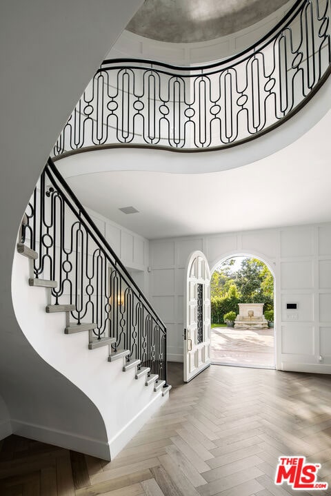 stairway with parquet flooring