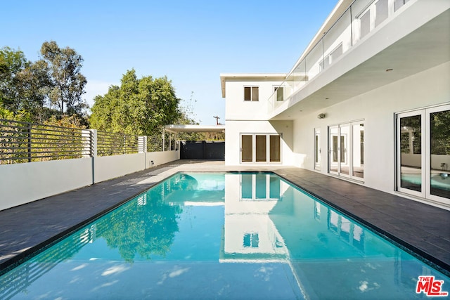 view of swimming pool with a patio