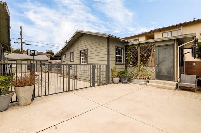 view of side of home featuring a patio