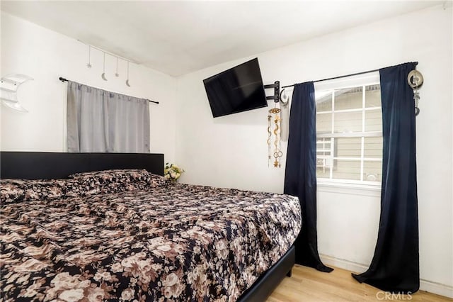 bedroom with light hardwood / wood-style flooring