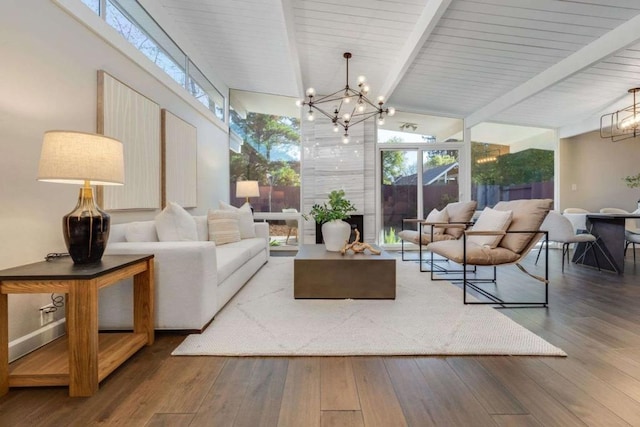 sunroom featuring a chandelier and lofted ceiling with beams