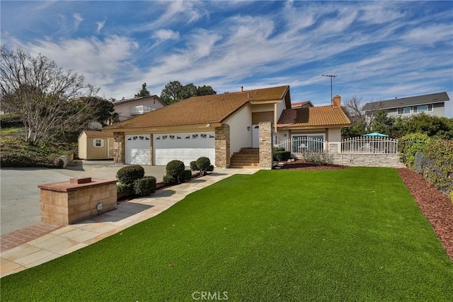 view of front facade featuring a garage and a front lawn