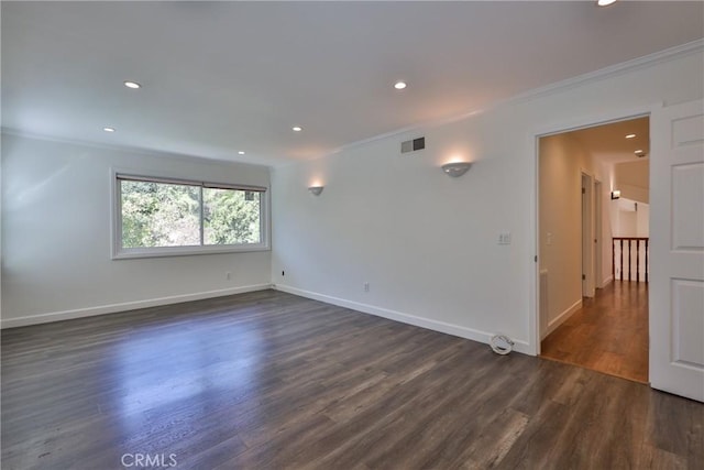 unfurnished room with dark hardwood / wood-style flooring and crown molding