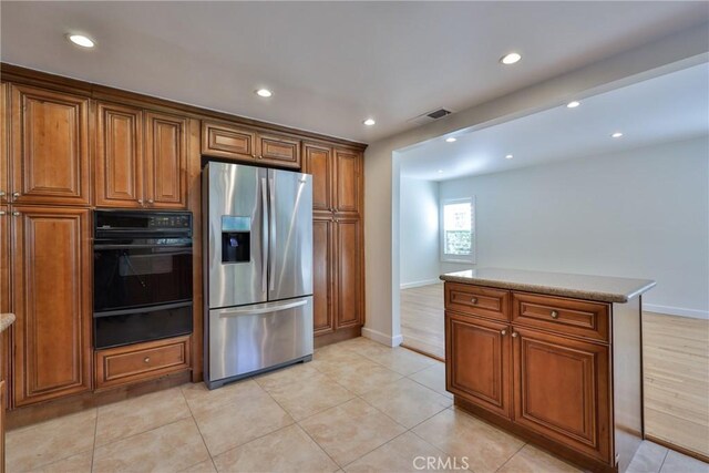 3179 Canal Point Dr, Hacienda Heights, CA 91745 - kitchen featuring stainless steel fridge with ice dispenser, black oven, a warming drawer, baseboards, and recessed lighting