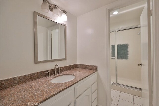3179 Canal Point Dr, Hacienda Heights, CA 91745 - full bathroom with vanity, a shower stall, and tile patterned flooring