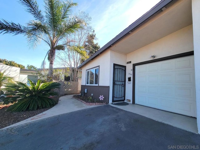 doorway to property featuring a garage