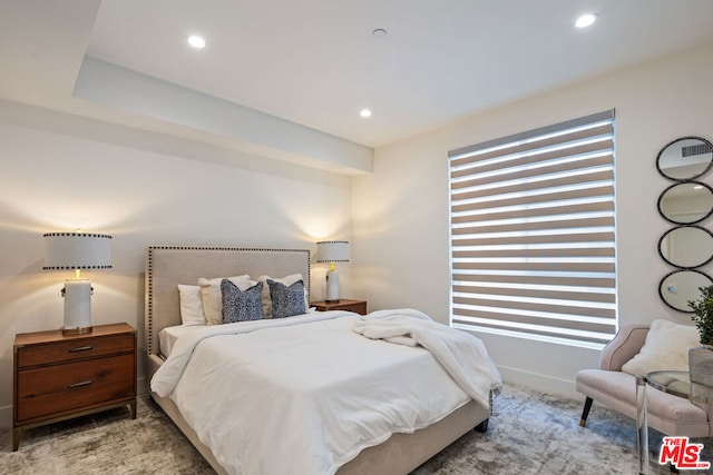 bedroom featuring light carpet