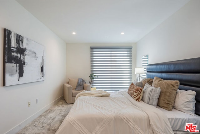 bedroom with light colored carpet