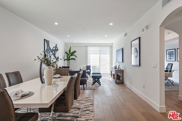 dining space featuring light hardwood / wood-style floors