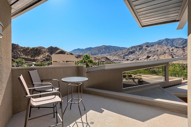 balcony featuring a mountain view