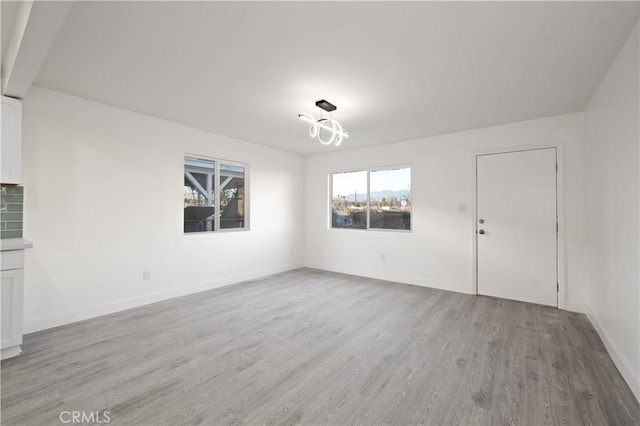 empty room with light wood-type flooring