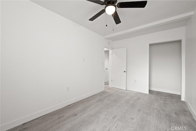 unfurnished bedroom with light wood-type flooring and ceiling fan