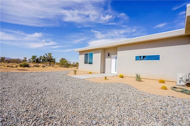 rear view of house with a patio