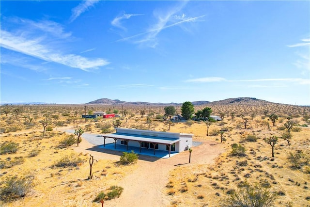 birds eye view of property featuring a mountain view