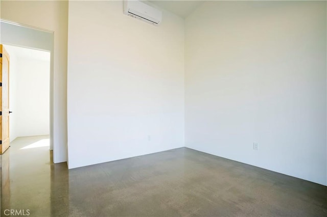 empty room featuring a wall mounted air conditioner